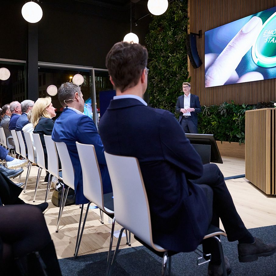 Person giving a presentation in front of an audience