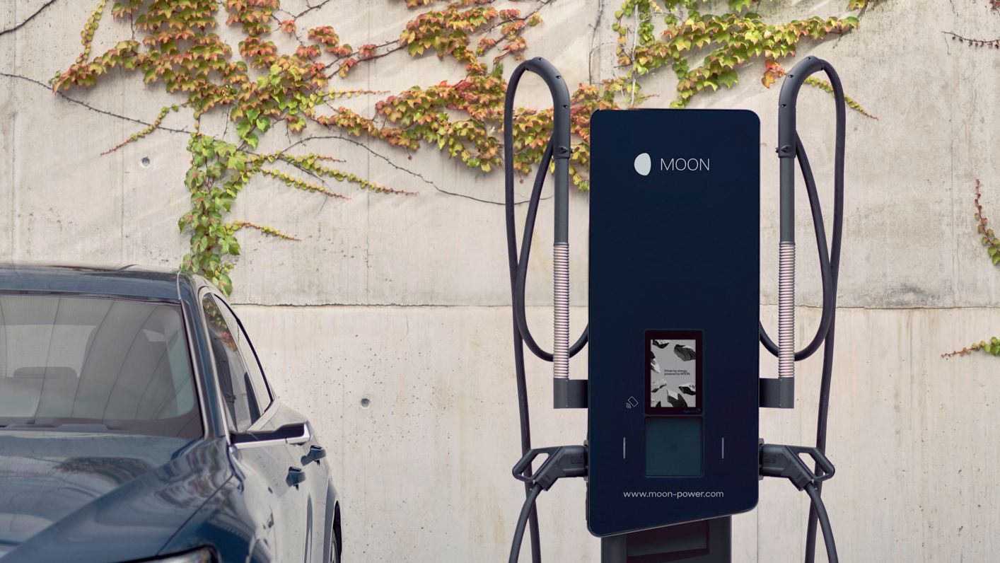 Electric car is parked next to a wallbox