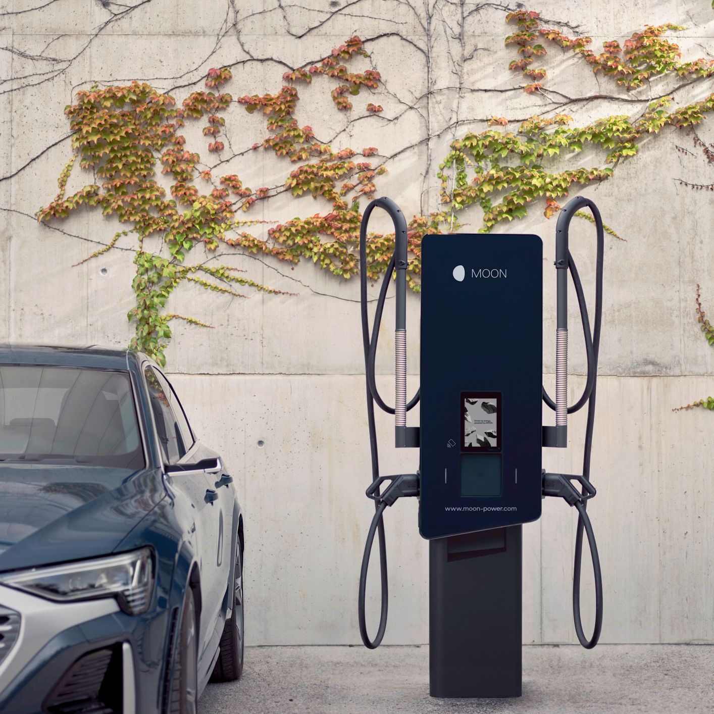 Electric car is parked next to a wallbox