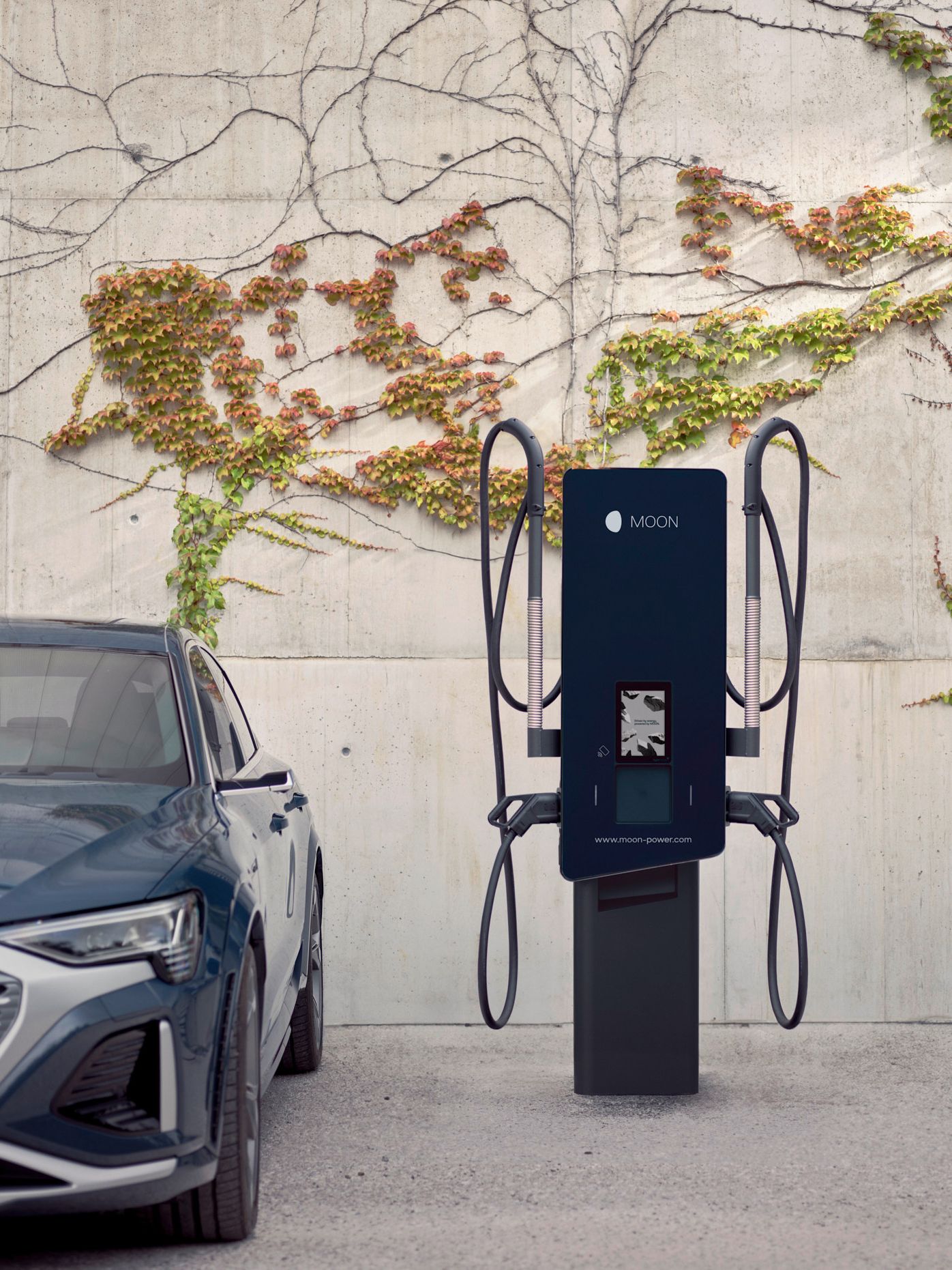 Electric car is parked next to a wallbox