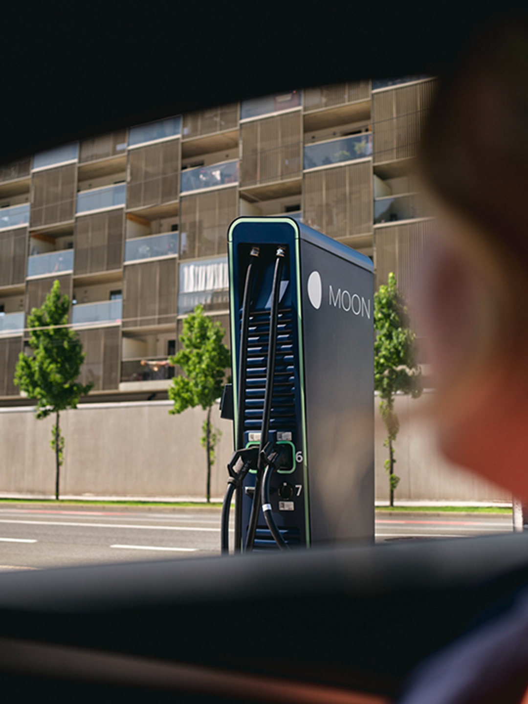 Fast charging station in front of a street