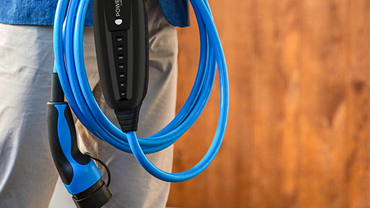 Person holding MOON charging cable