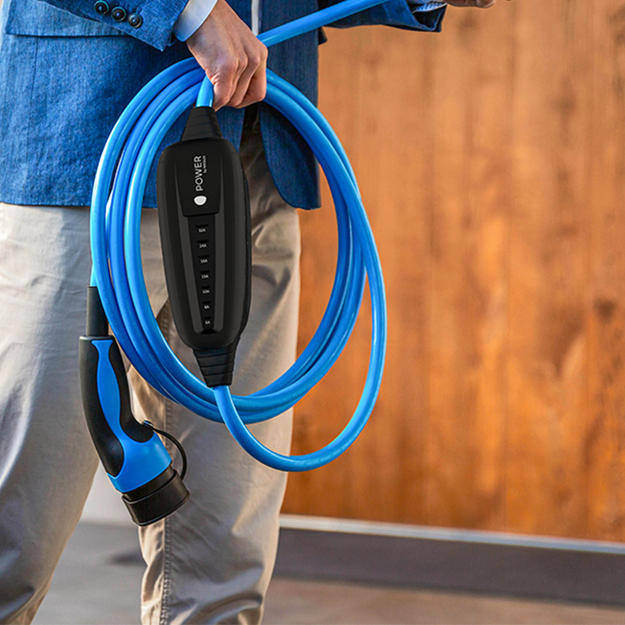 Person holding MOON charging cable